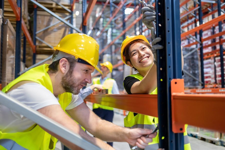 Installer dismantling pallet racking