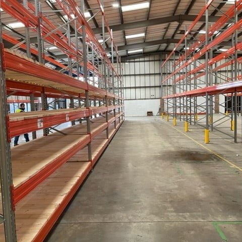 Customer warehouse with rows of racks